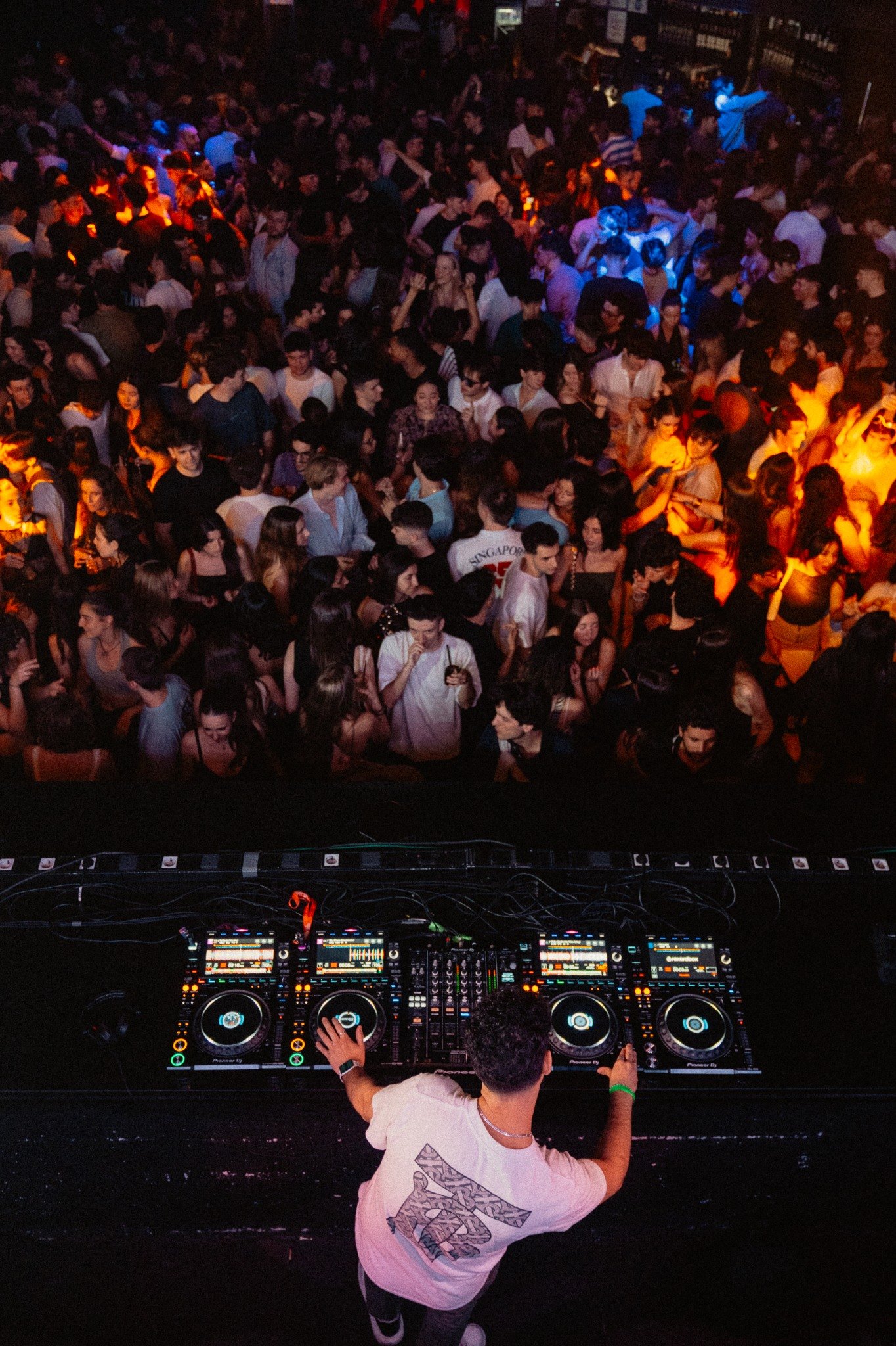 BAAT DJ setup above a packed dancefloor